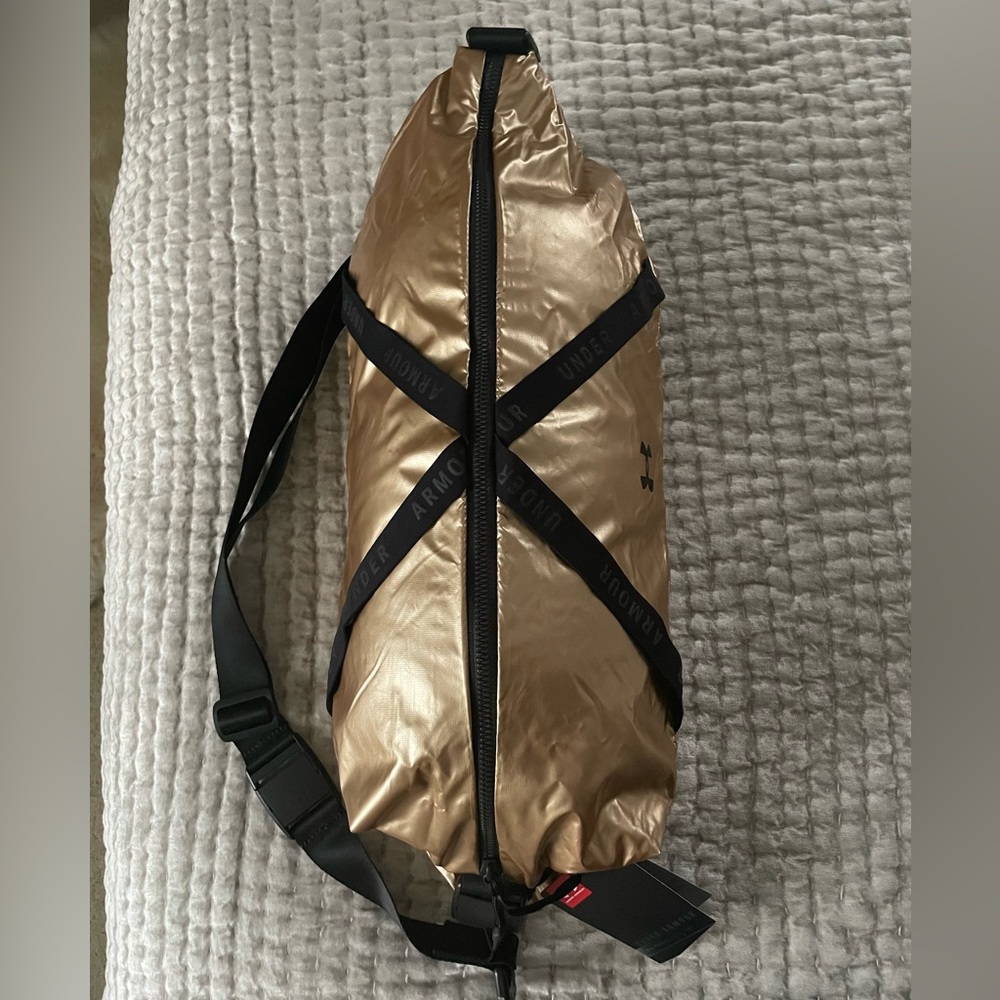 NWT Under Armoir Sling bag Gold